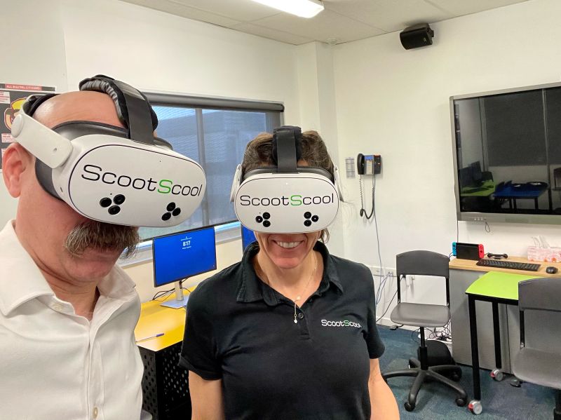Kenn and Prue wearing VR headsets at Scoot Scool session